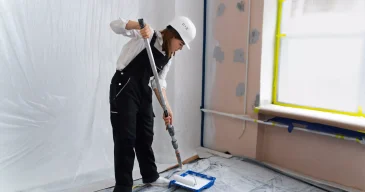 full-shot-woman-working-with-paint-roller